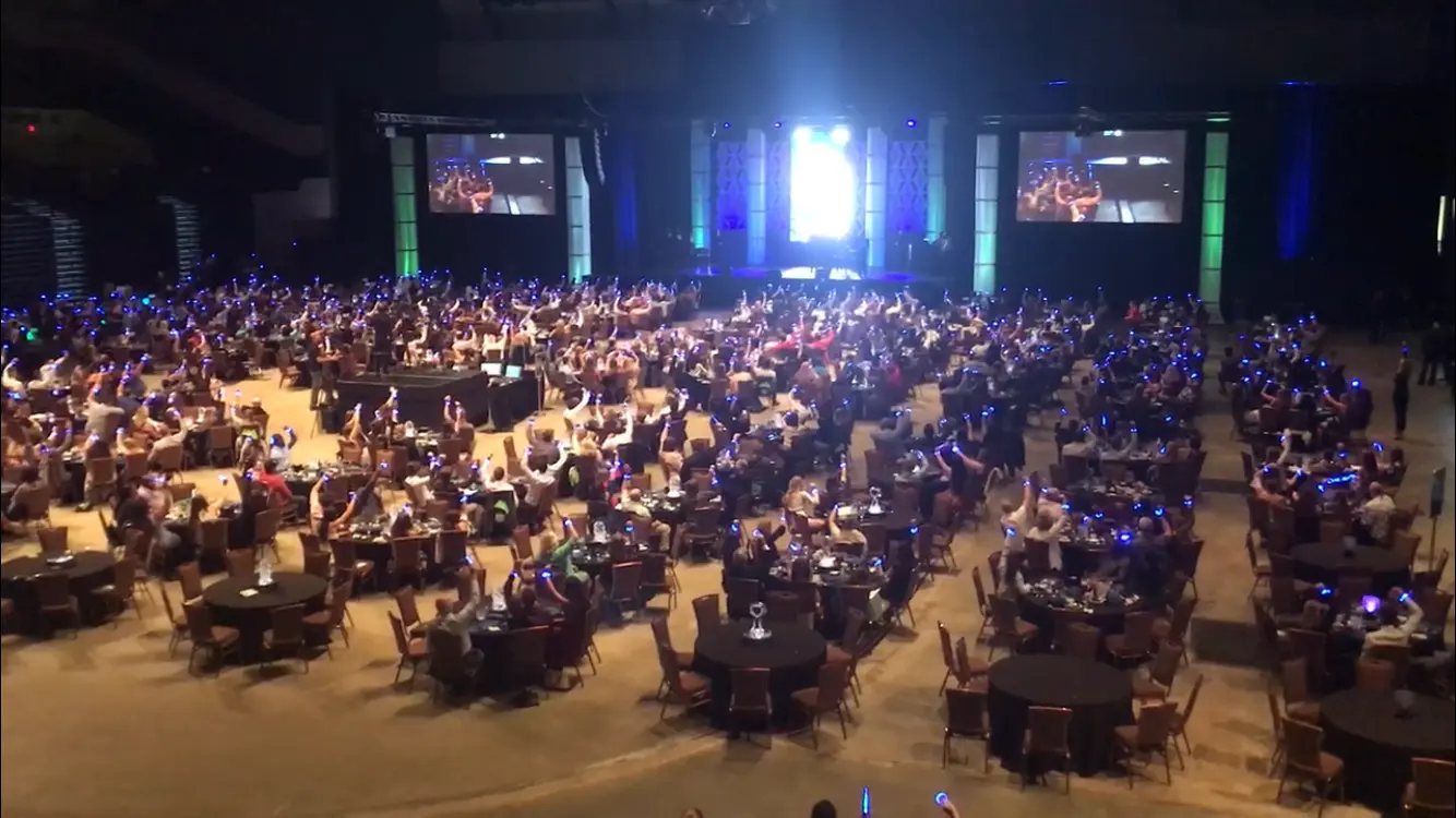 A large crowd at an evening public event