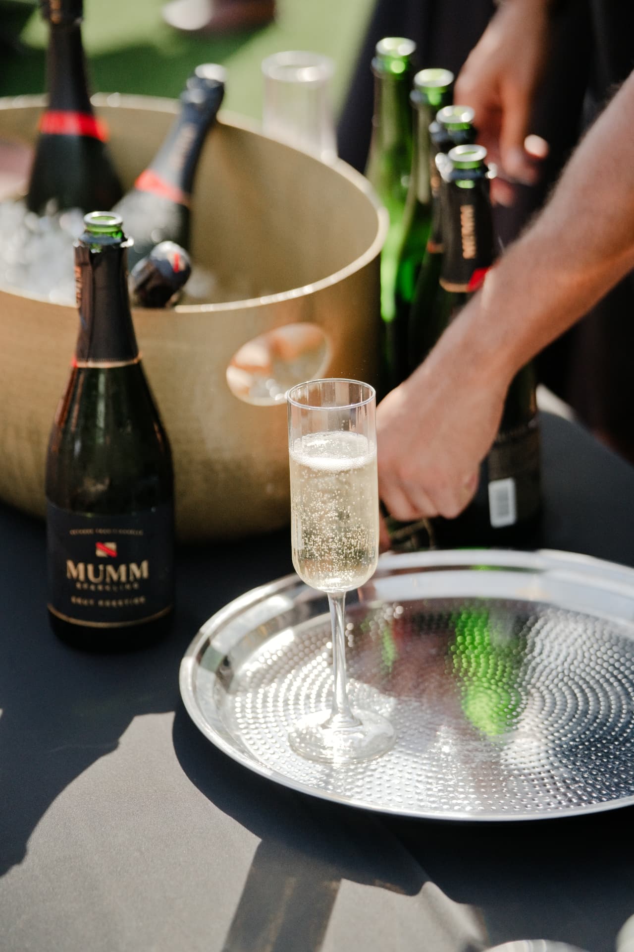 Sparkling wine poured on a silver tray