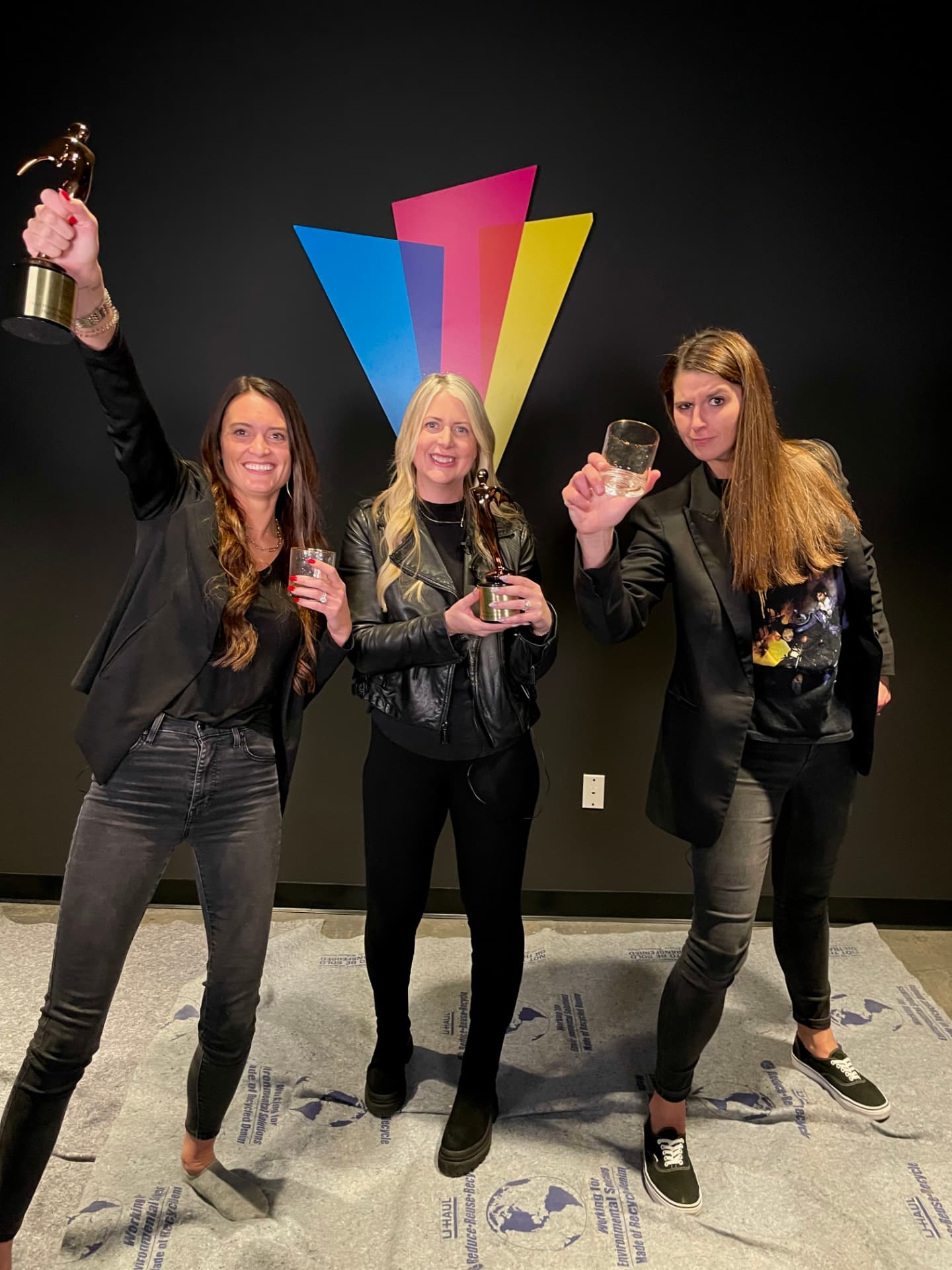 Award recipients celebrating with trophies