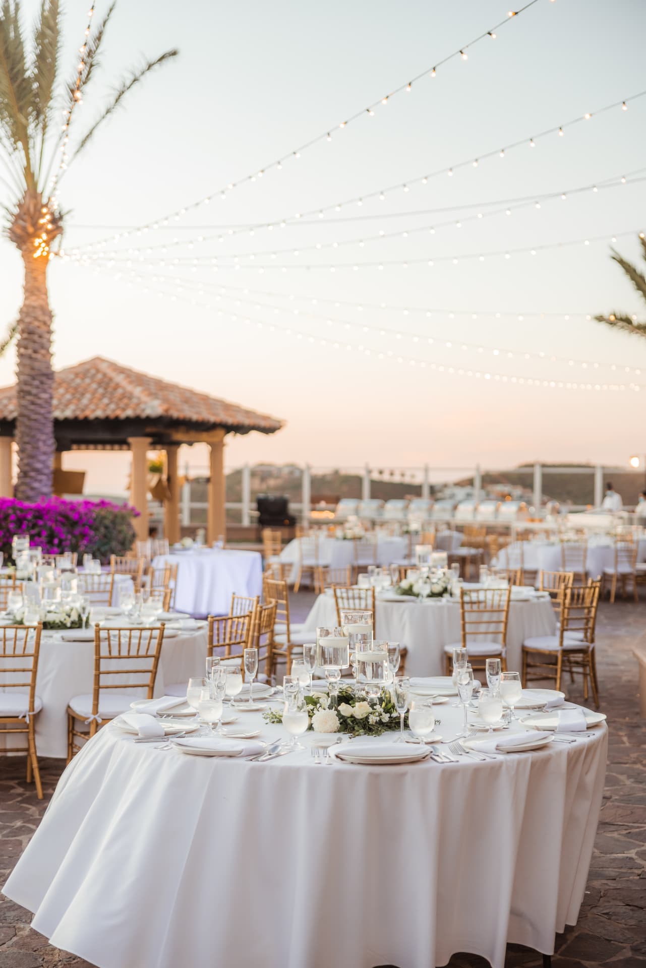A sunset reception under string lights