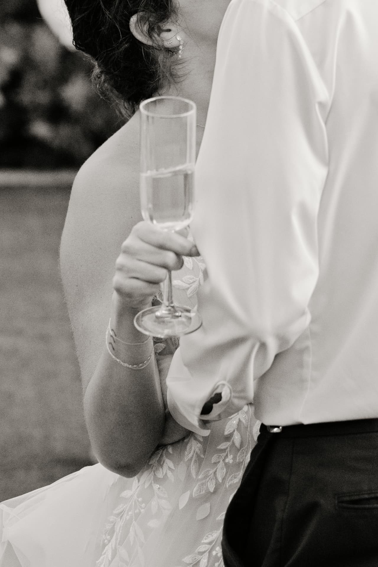A guest raising a champagne glass during a celebration