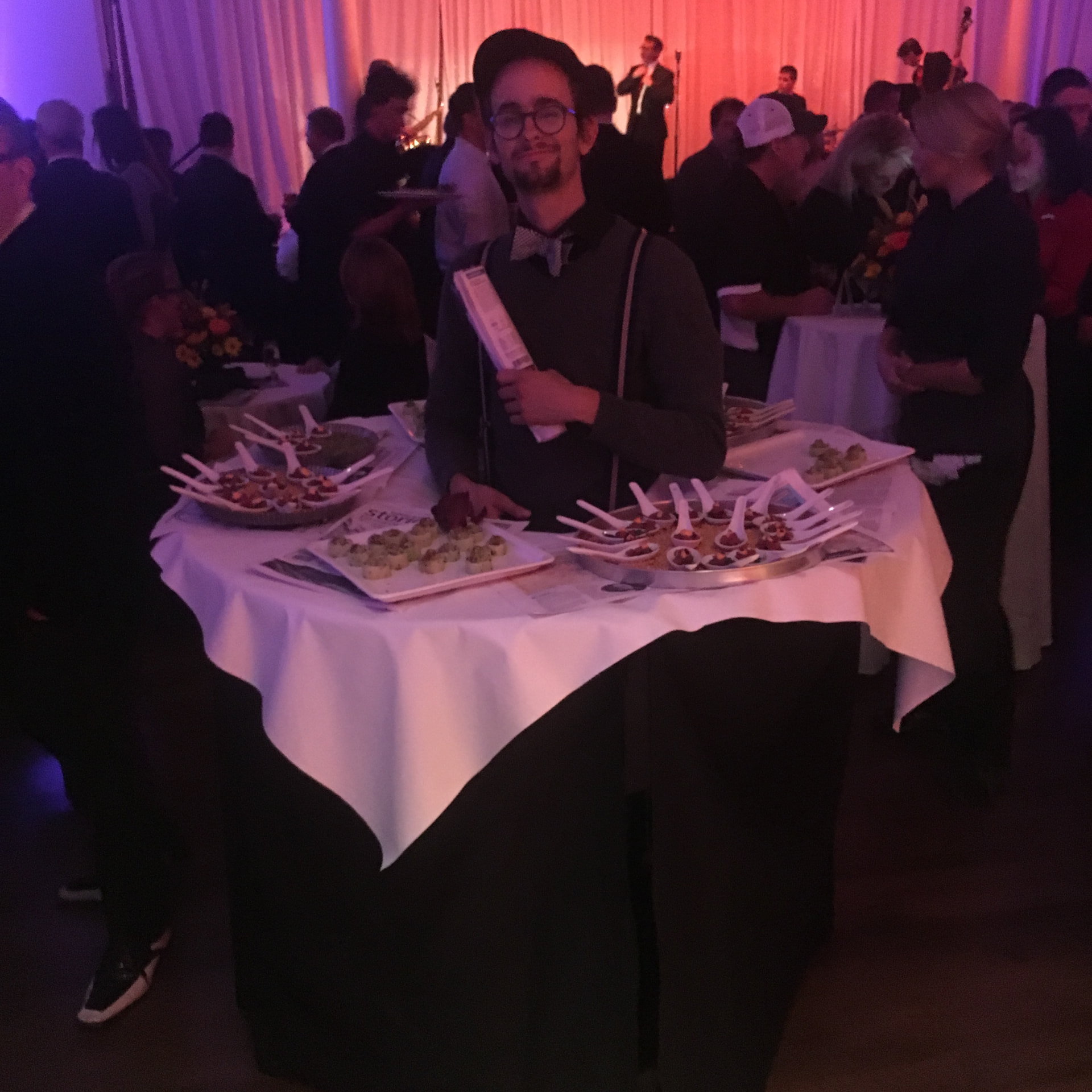 A server passing hors d'oeuvres at a reception