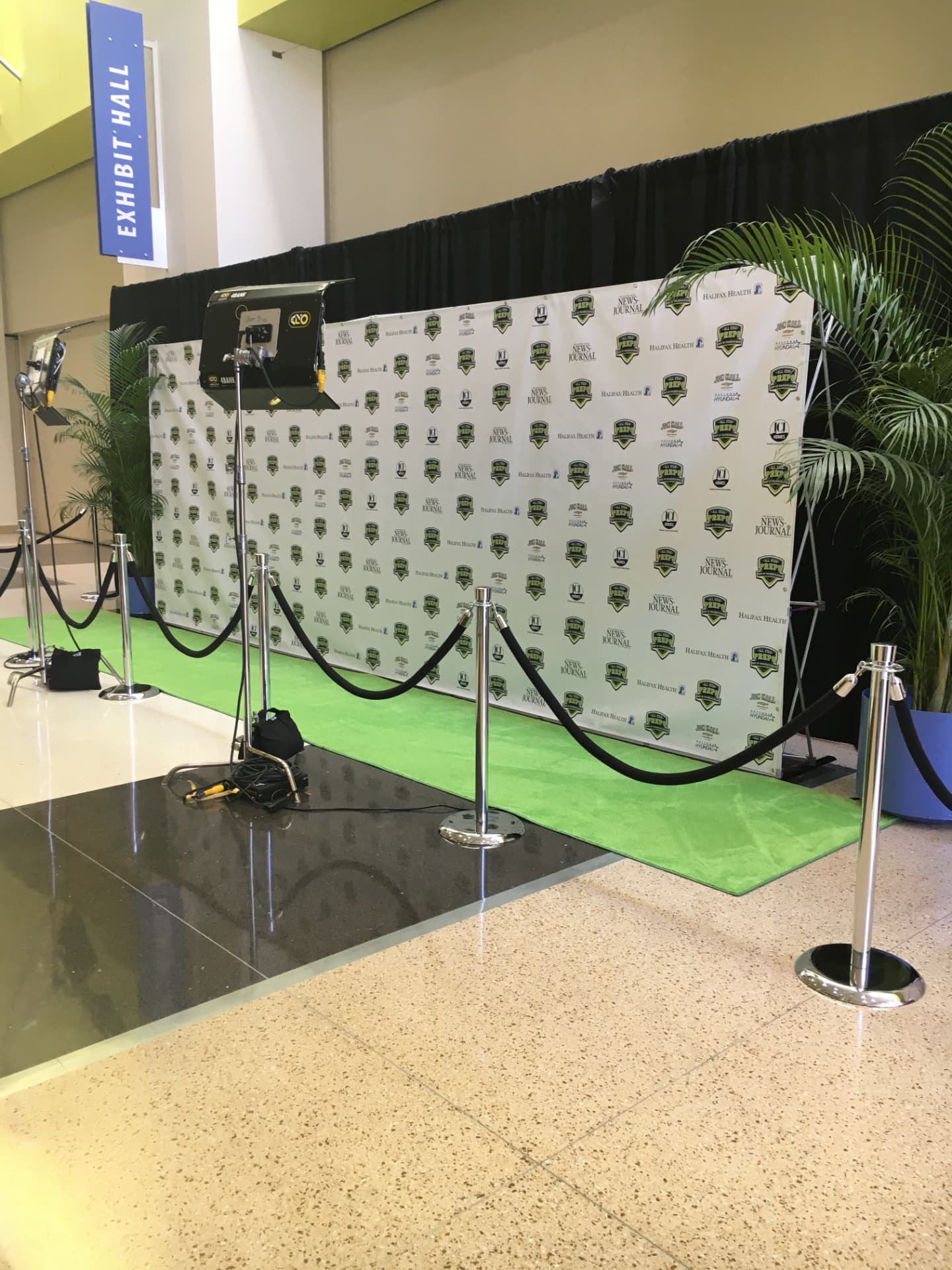 An expo photo activation with sponsor signage
