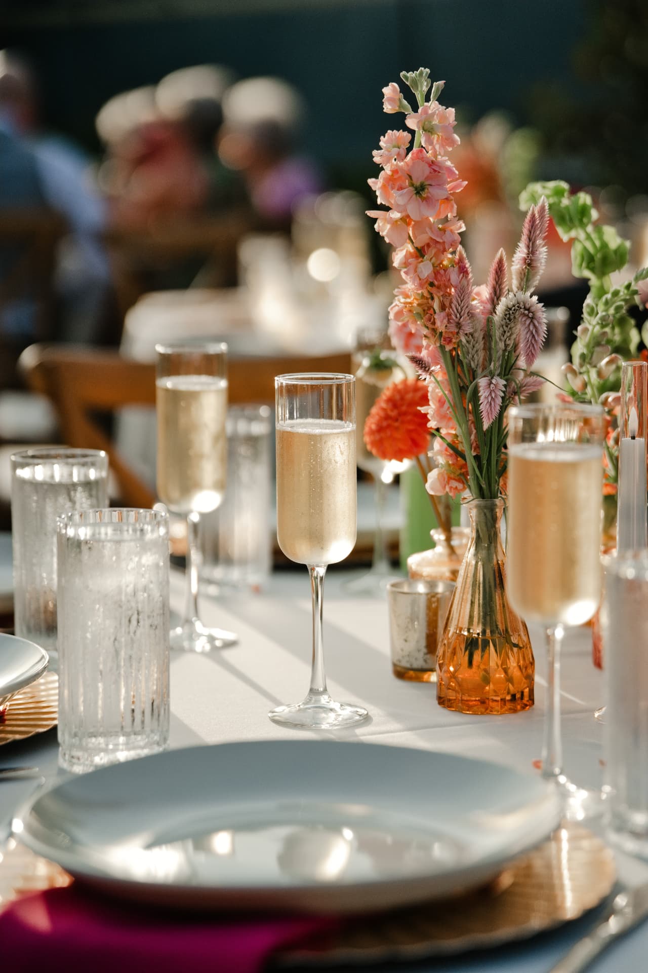 A bright tablescape with candles and florals